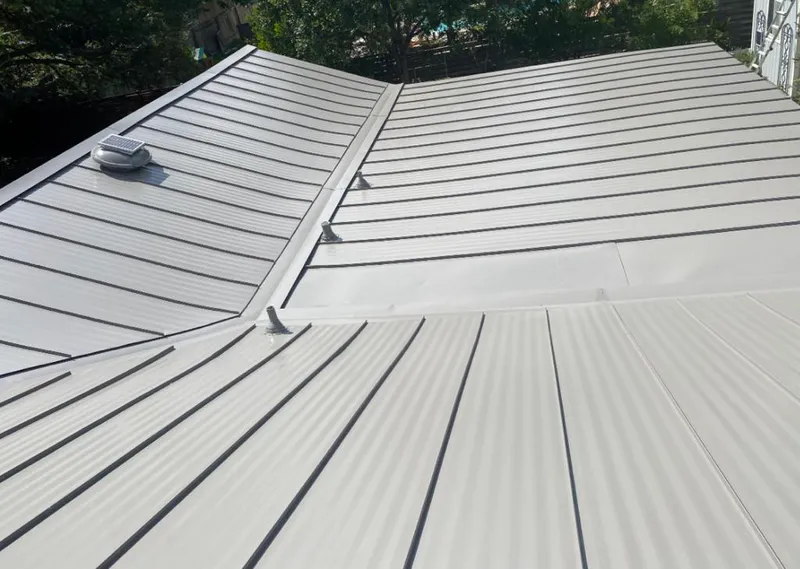 Solar attic fan installed on a metal roof for Roof Ventilation in Timberwood Park