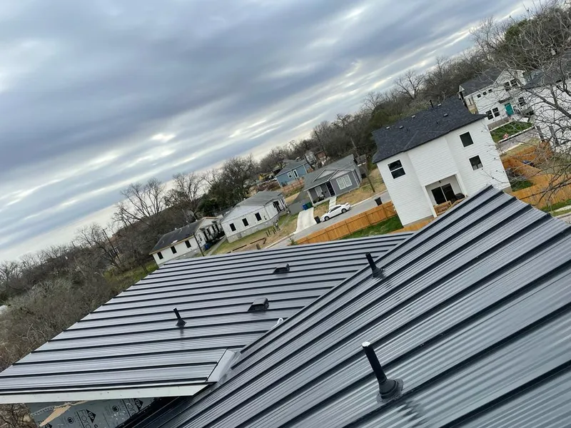 Standing seam metal roof panels with vents for Skylight Repair in Timberwood Park